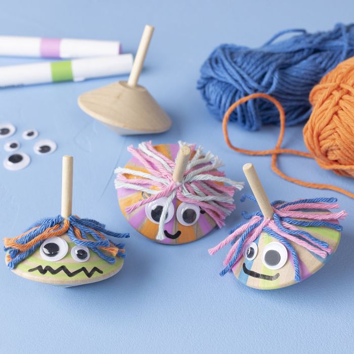 Toupies avec yeux loucheurs et cheveux amusants