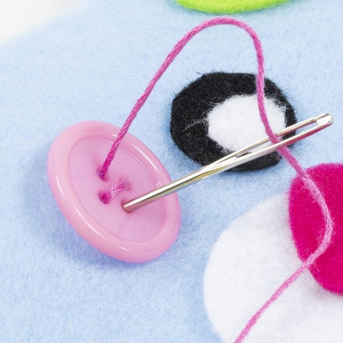 Couture sur un bouton
