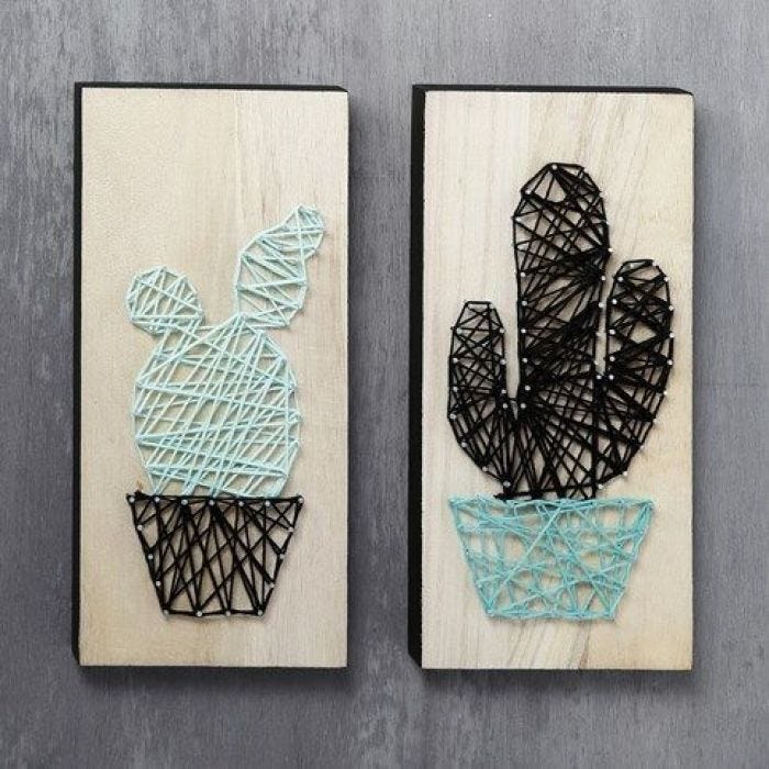 Des cactus artistiques fait avec de la ficelle sur des planches en bois