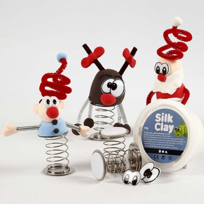 Silk Clay Christmas Figures on a coiled Spring