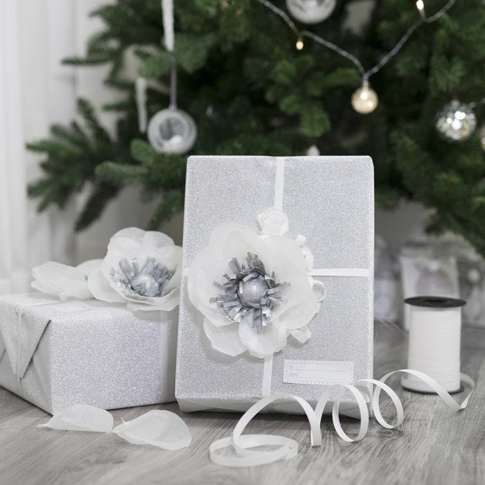 Gift wrapping decorated with a tissue paper flower