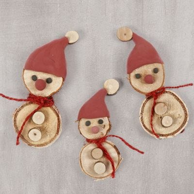 Elves made from wooden discs with a Silk Clay elf's hat