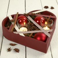 A Heart-Shaped Wooden Bowl with Decorations