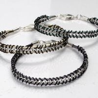 Bracelets braided around a Jewellery Chain and Leather Cords
