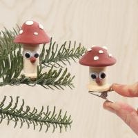 Toadstools made from bobbins decorated with Silk Clay and googly eyes